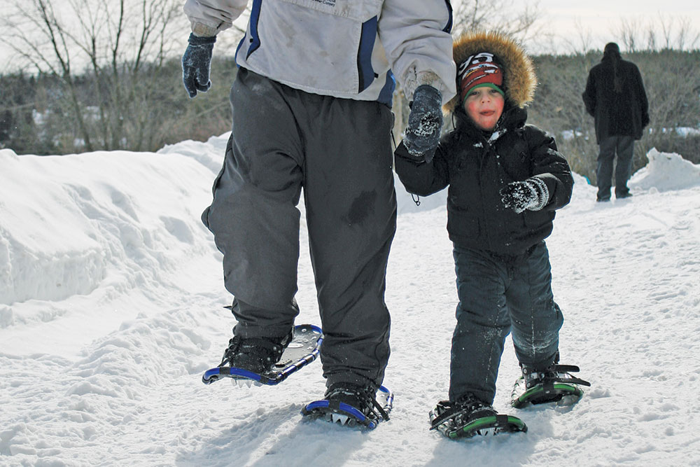 Father and Son snow shoeing the trails in Elora-Fergus 